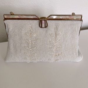 Vintage white beaded purse with mother of pearl clasp and silk lining.